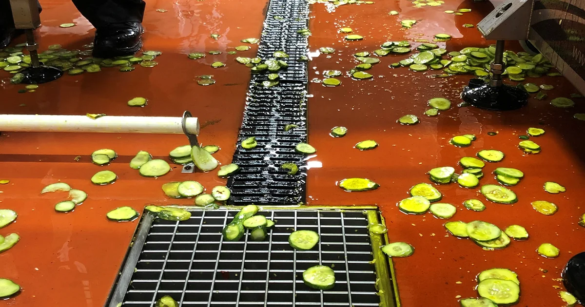 Food packaging plant with pickles on red polyurethane flooring